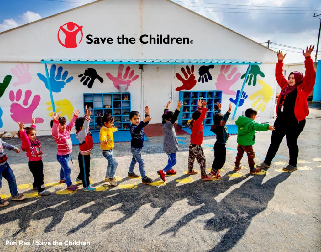 children in a line - Save the Children