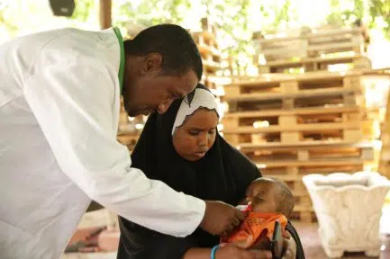 First Responder Abdi cares for a patient in Somalia.