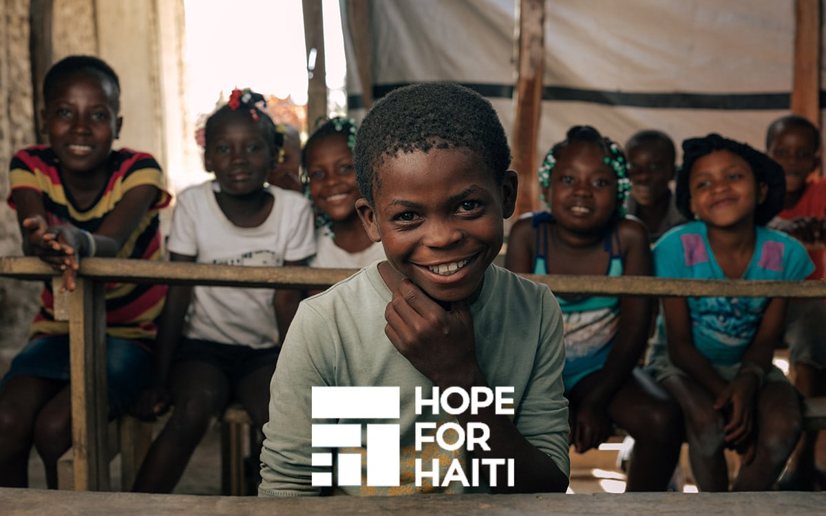 A boy sitting in a classroom in Haiti