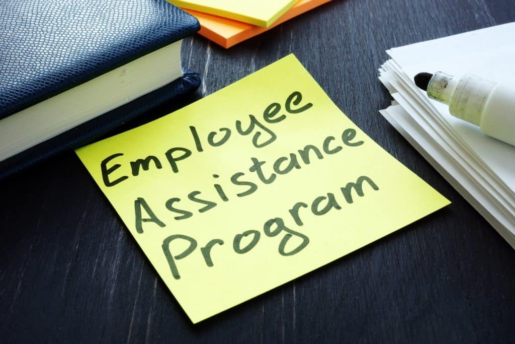 Yellow sticky note reading "Employee Assistance Program."