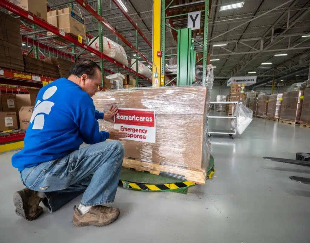 Man wrapping boxes on a pallet