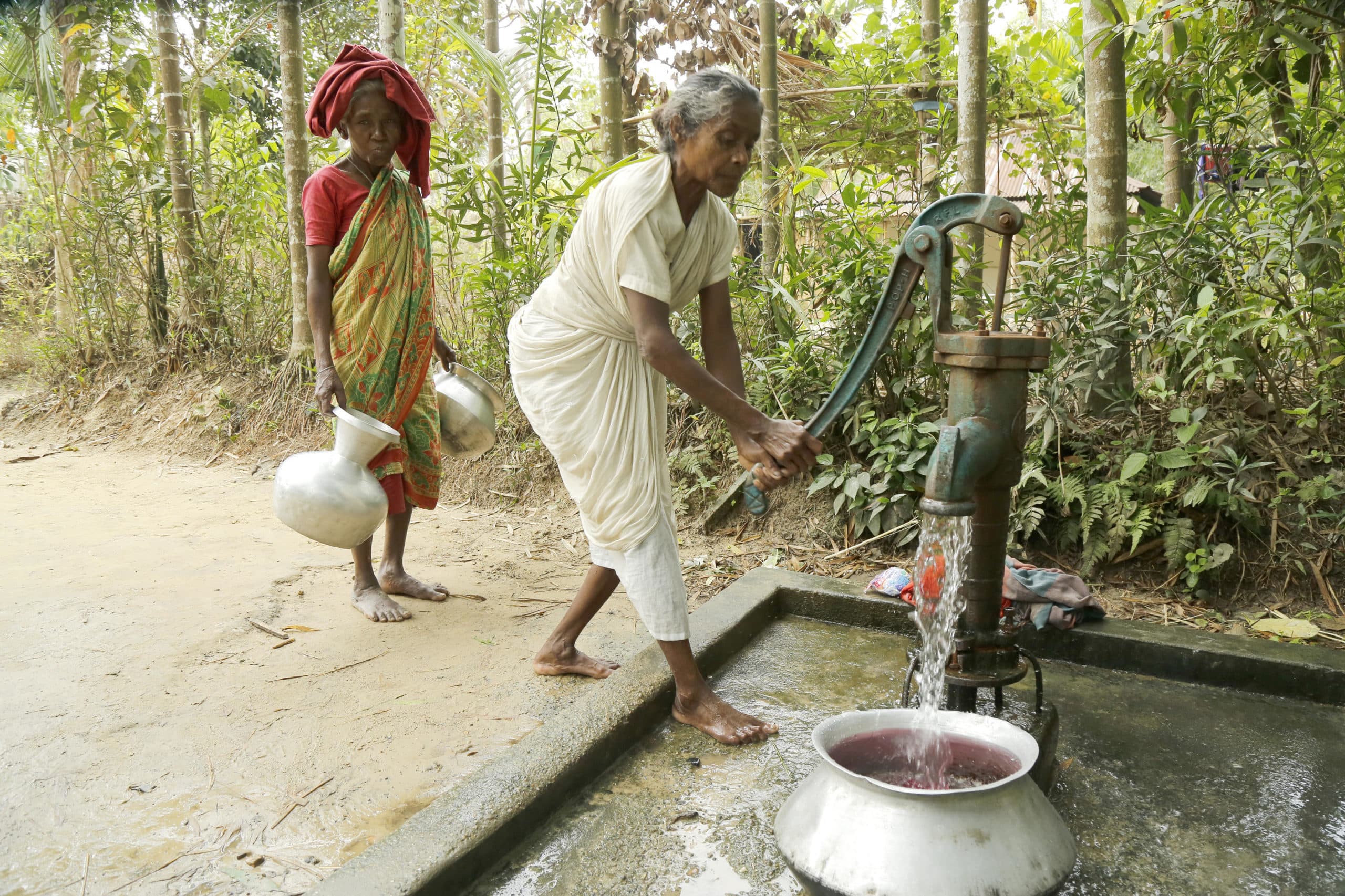 A woman at a water pump