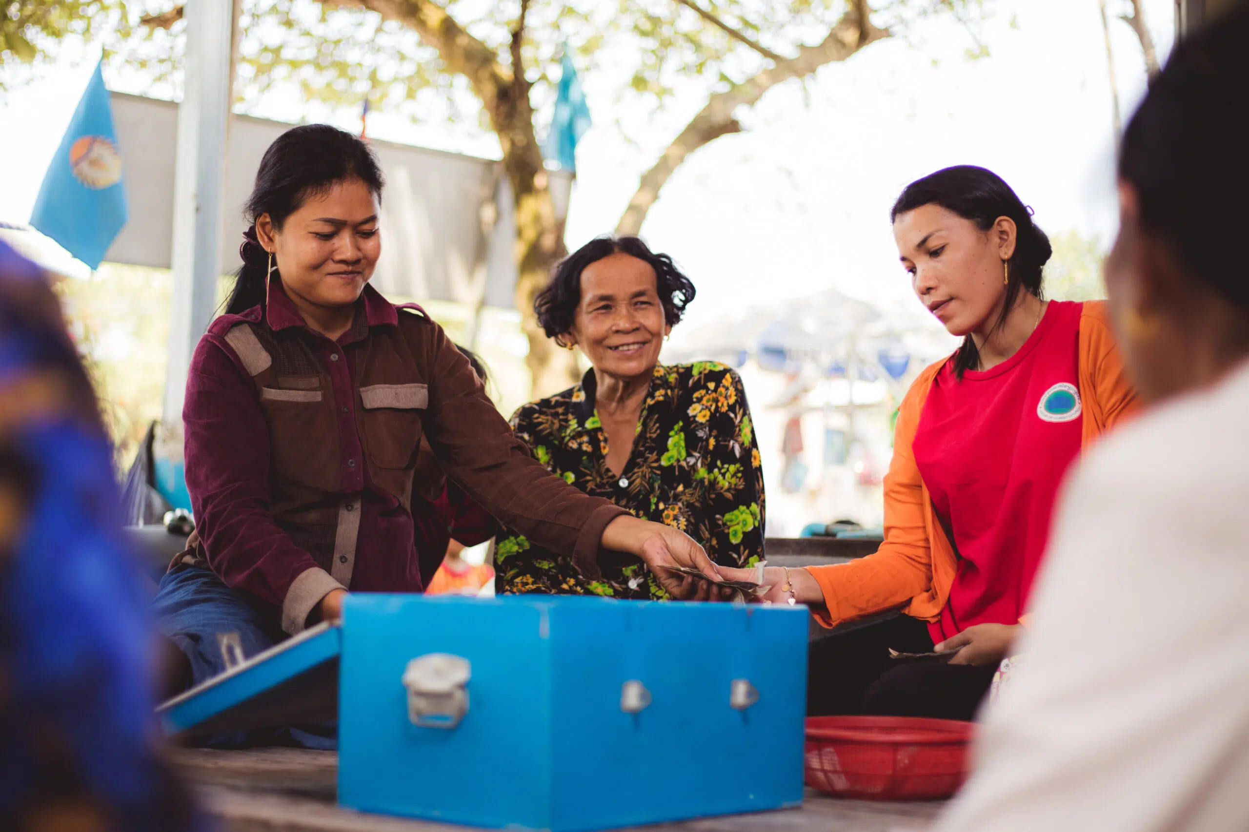 Women gather for their weekly savings meeting 