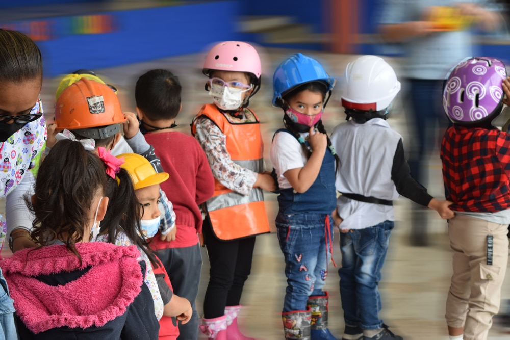 7 preschoolers wearing helmets