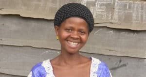 A black congolese woman smiling