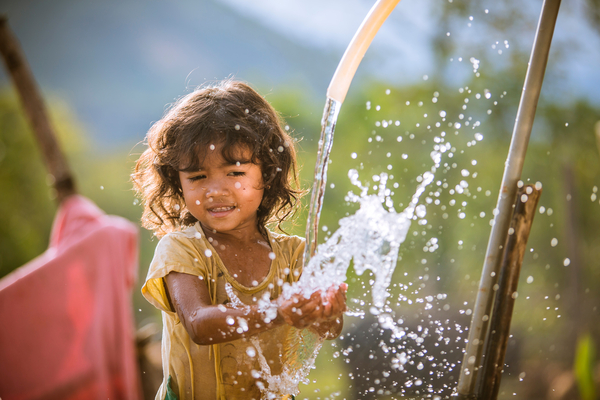 Pinang Thi Thuy, Raglai ethnic minority 5 years girl, enjoys her family's clean water source in Bac Ai, Phuoc Hoa, Ninh Thuan. Thuy's family was suffered great crop failure due to the historical drought in Viet Nam, 2015-2016. In addition her younger brother was born at that time, so her mom did not have enough time to take care of Thuy with other two children, therefore Thuy was diagnosed malnourished and stunted.