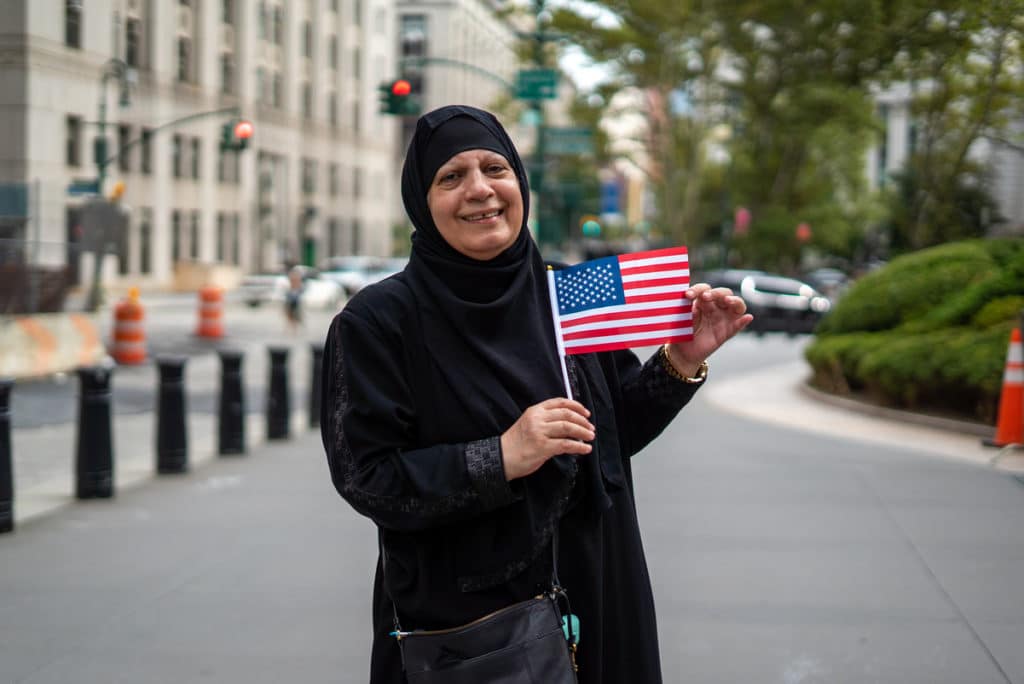 Iraqi woman holding a US flag