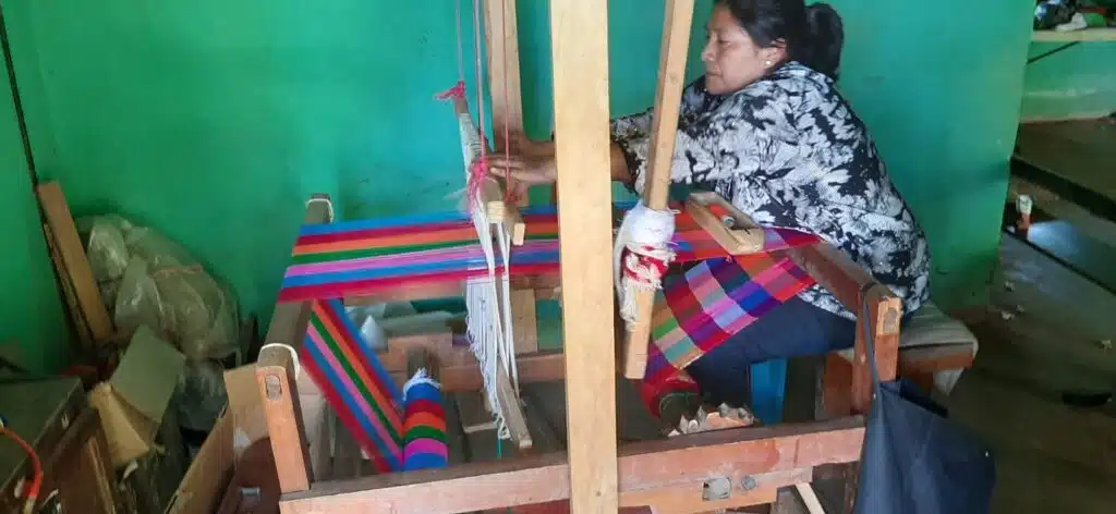 A woman in Honduras weaving.
