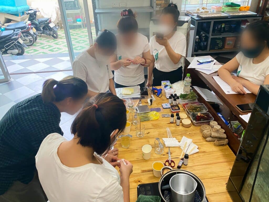 Women around a table with supplies