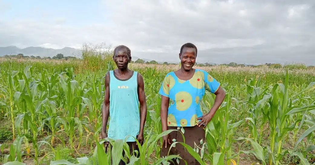 Night and her husband in a field in South Sudan