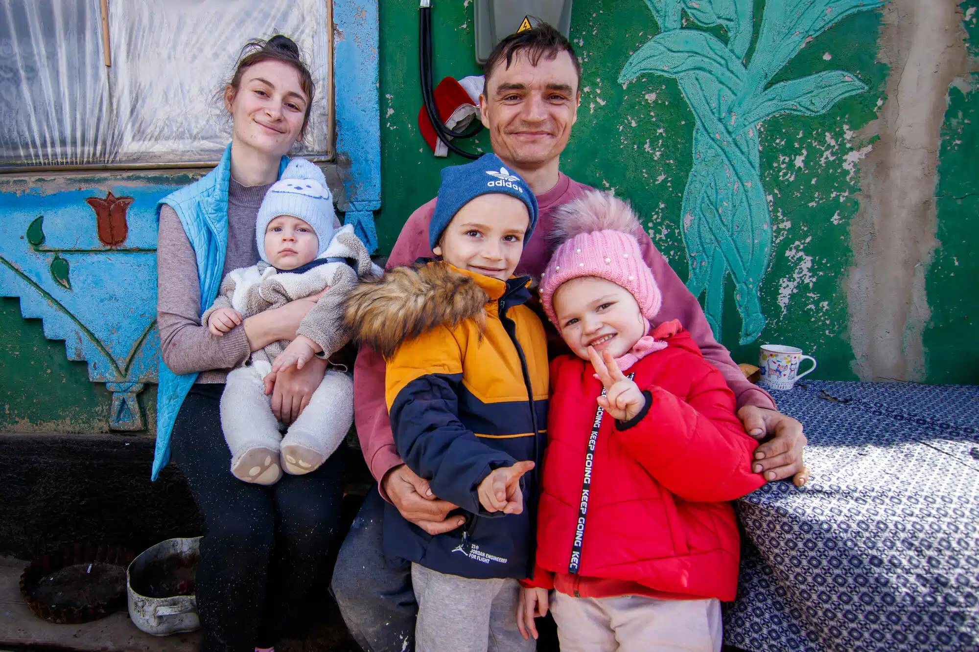 Ukrainians Ivan, Elena, and their three children are refugees in Moldova where they share a house with six other Ukranian refugees.