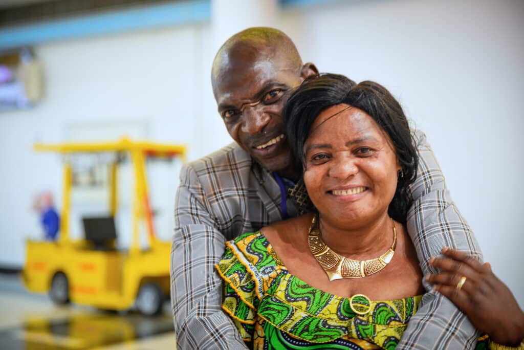 Newlyweds Goreth and Mbimbi pose together
