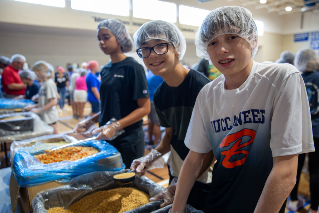 Students from The Benjamin School in Palm Beach County were among the volunteers who assembled at Advent Lutheran Church to help pack MannaPack rice meals for children and families in need in Honduras.