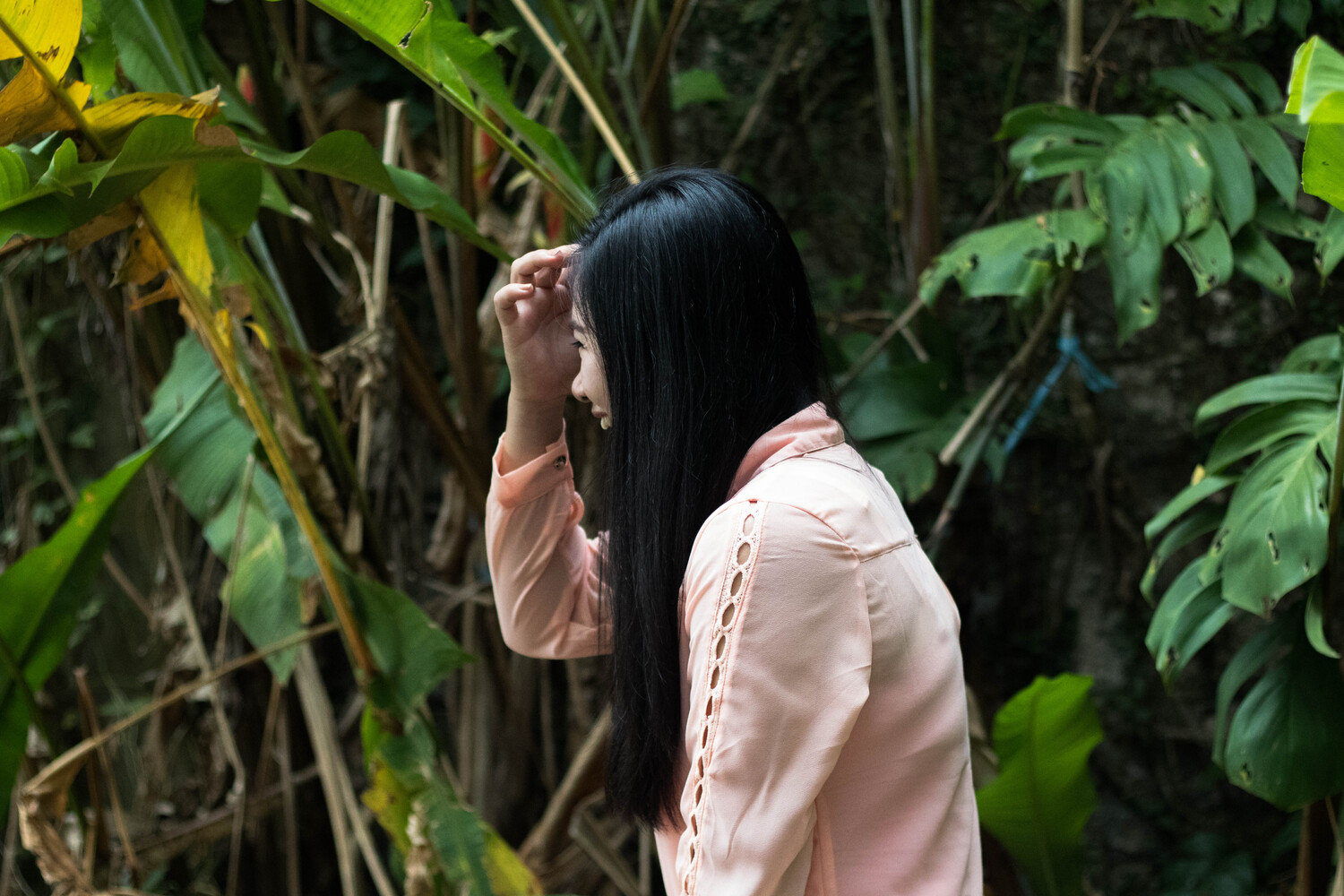 Girl facing sideways in a jungle