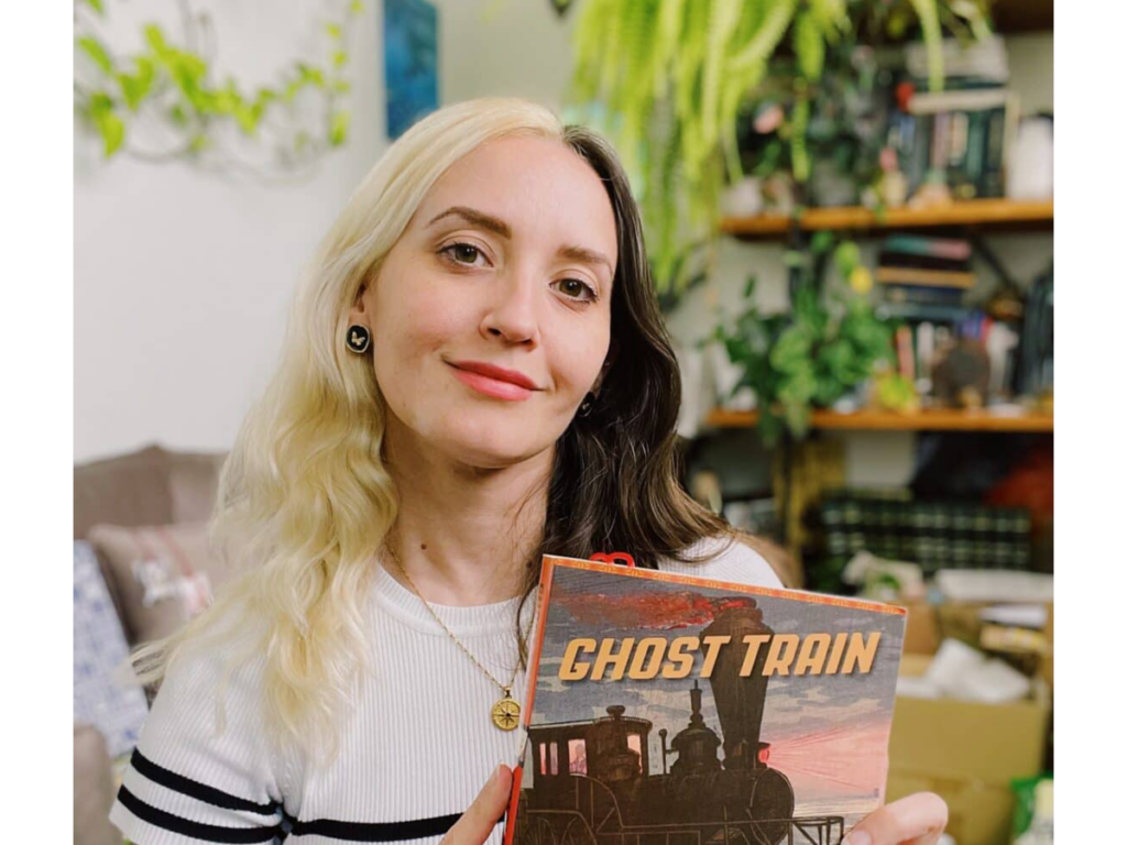 Natalie Jacobsen with her book Ghost Train