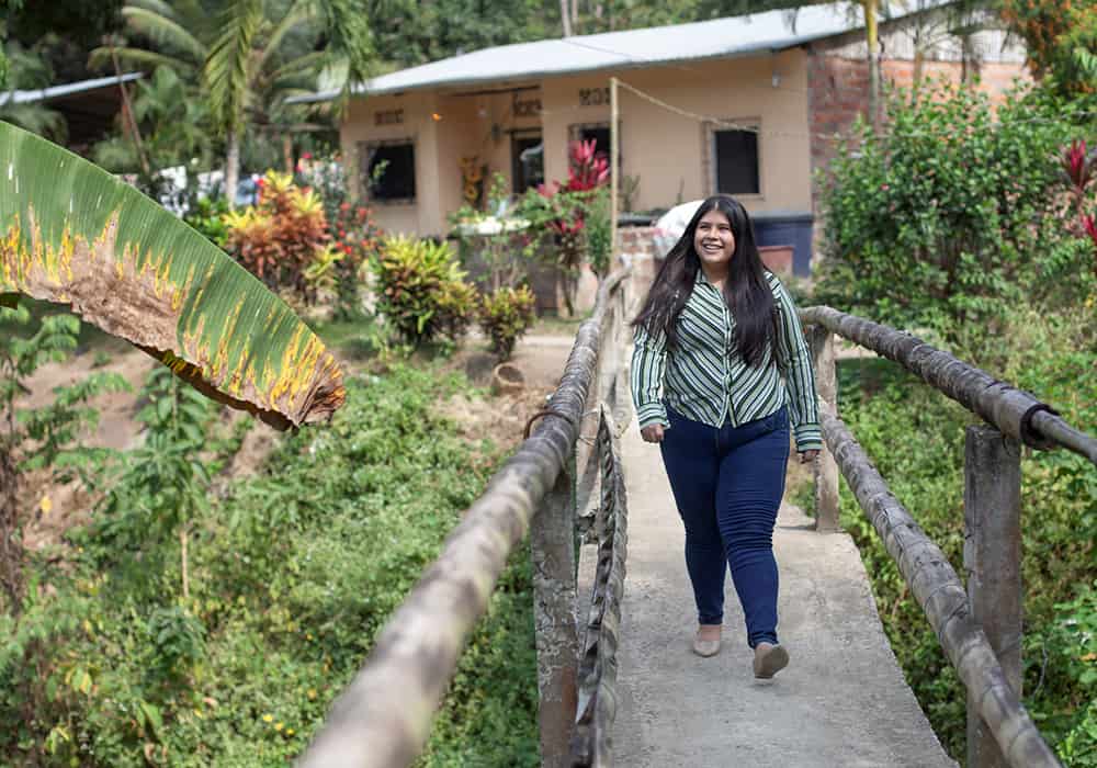 A girl smiling and walking